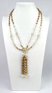 Vintage Double Strand Faux Pearl and Crystal Flapper Necklace: Vintage double strand necklace featuring champagne-hued faux pearls and faceted clear glass crystals, culminating in a dramatic beaded tassel drop. The centerpiece includes a floral crystal accent wit