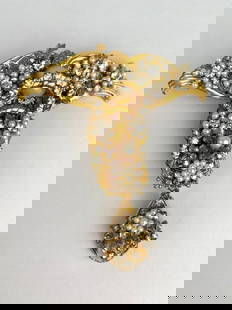 Stanley Hagler NYC Baroque Pearl and Rhinestone Brooch: Signed Stanley Hagler NYC brooch in an ornate design. Featuring clusters of baroque faux pearls and clear rhinestones set in layered gilt filigree, the piece includes a drop dangle element for added m