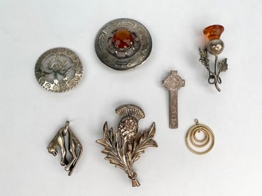 Collection of Seven Sterling Silver and Silver Tone Brooches and Pendants