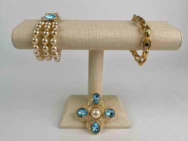 Nolan Miller costume jewelry set featuring three statement pieces. The set includes a triple-strand