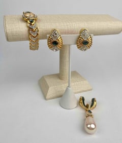 Nolan Miller designer jewelry lot featuring a sparkling quartz wristwatch, coordinating clip-on