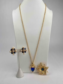 Lot of signed Nolan Miller jewelry featuring rich blue and pearl accents. The lot includes a