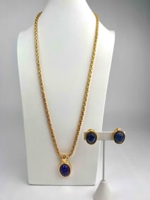 This is a signed Kenneth Jay Lane (KJL) Egyptian revival jewelry set featuring a bold scarab motif.