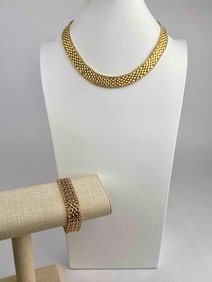 Signed Kenneth Jay Lane (KJL) necklace and bracelet set featuring matching gold tone woven mesh