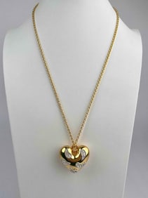 Signed Kenneth Jay Lane (KJL) gold tone heart pendant necklace, featuring a sculptural puffed heart
