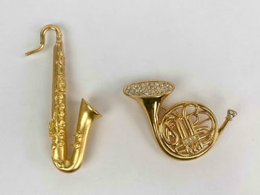 Lot of two vintage brooches by Kenneth Jay Lane, each representing a musical instrument in gold