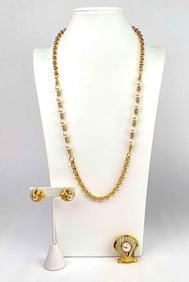 Set of 3 jewelry pieces by Nolan Miller. Set includes a necklace with faux pearls and a gold tone