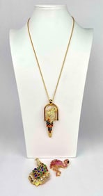 Lot of bird jewelry by Nolan Miller. Lot includes 1 peacock brooch, 1 flamingo brooch and 1 parrot