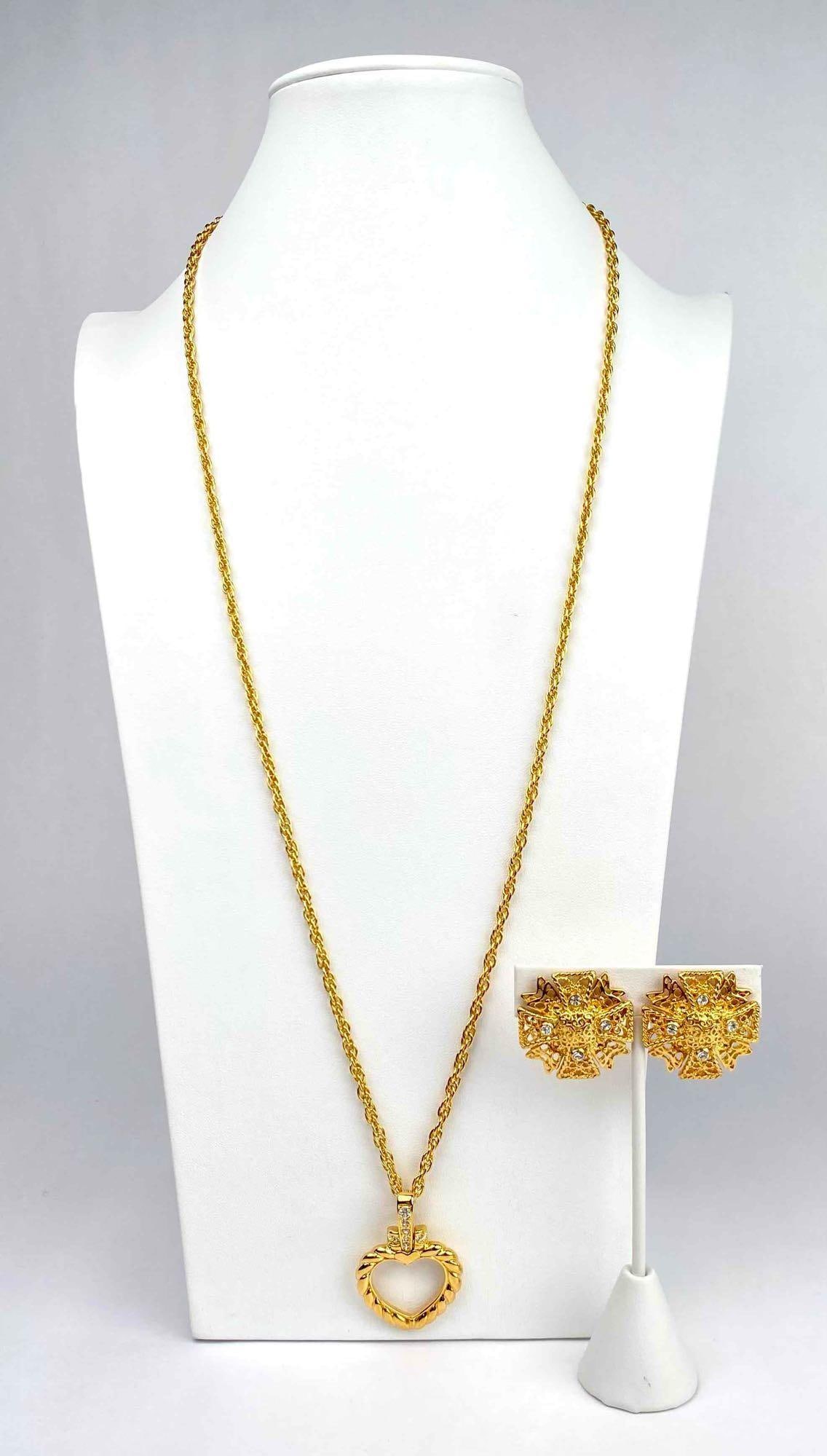 Gold tone necklace and clip on earrings by Nolan Miller. Necklace has a heart shaped pendant with (1 of 10)