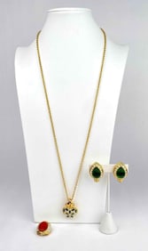 3 jewelry pieces from Nolan Miller. 1 necklace, 1 pair of clip on earrings and 1 pendant. All items