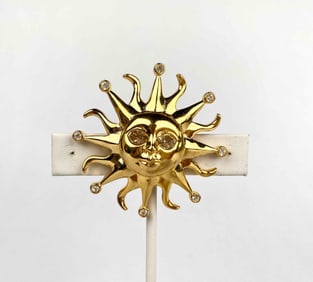 K.J.L. gold tone sun brooch with hanging rhinestone eyes. Brooch is hallmarked on the reverse with