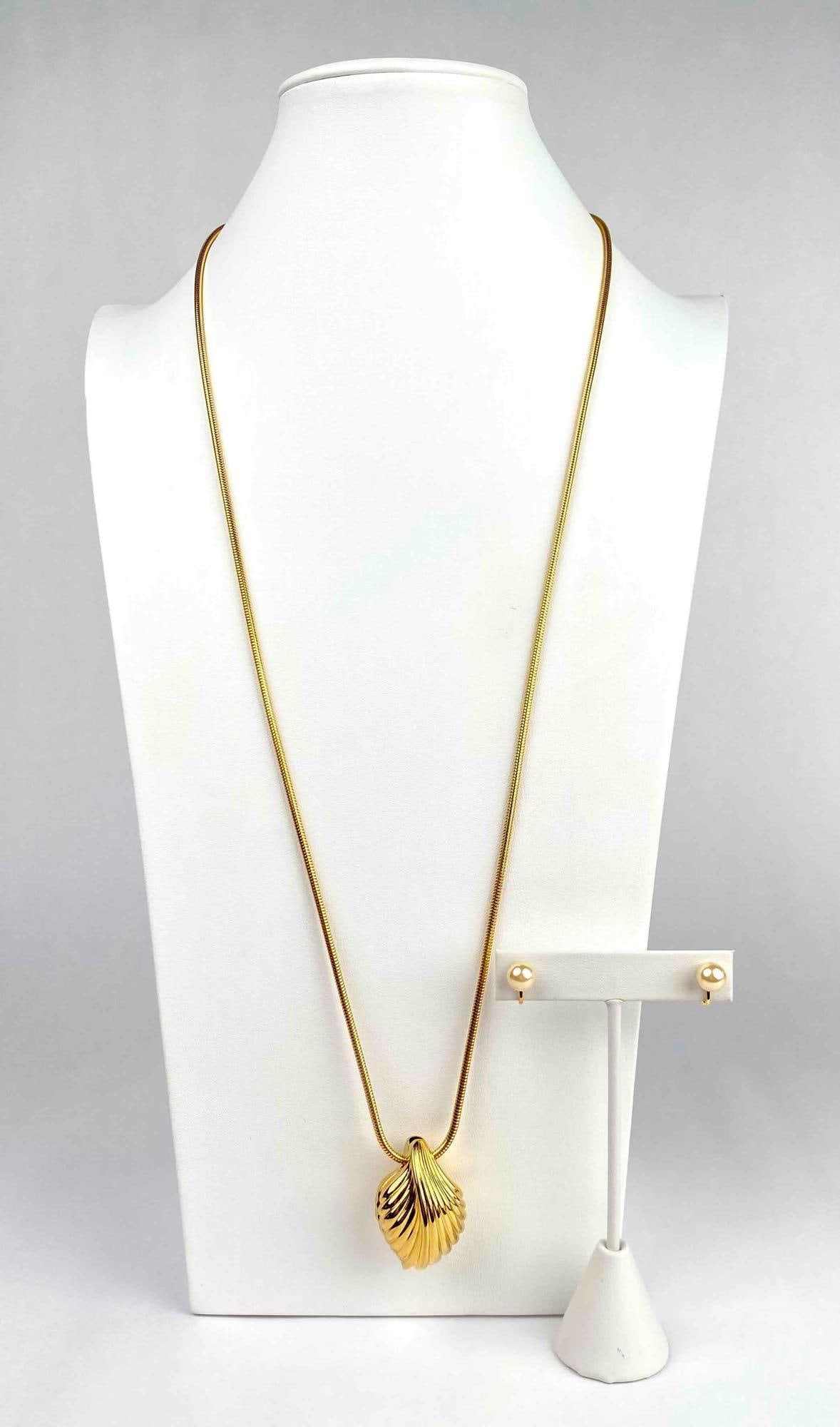 Gold tone shell necklace and gold tone faux pearl clip on earrings by Kenneth Jay Lane. Necklace (1 of 11)
