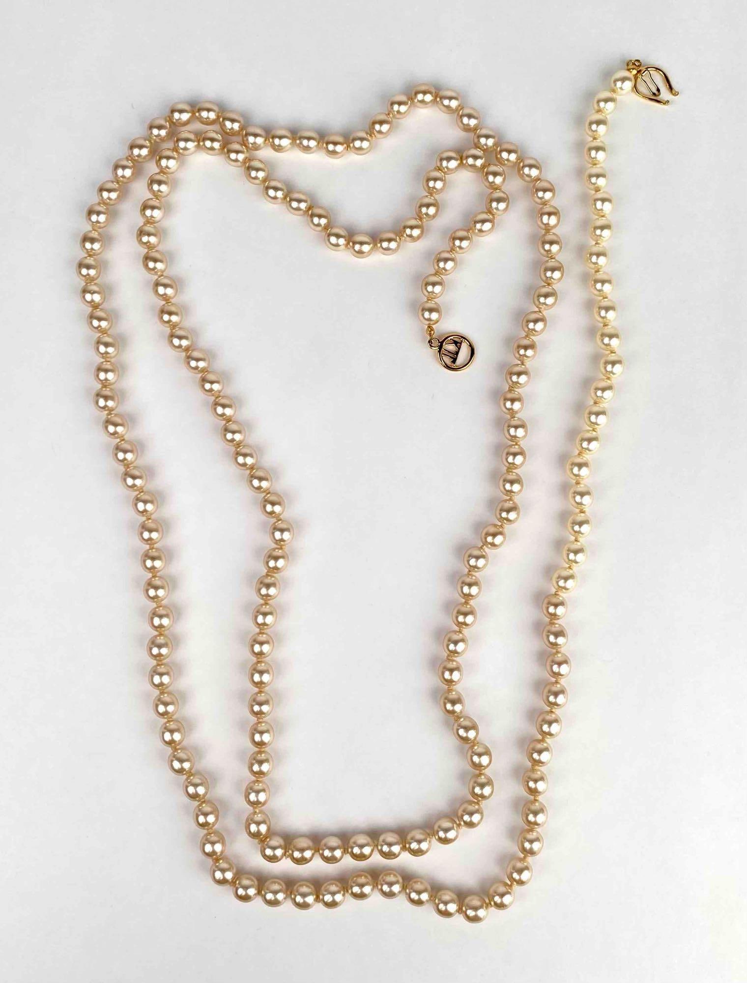 Faux pearl necklace by Kenneth Jay Lane. Necklace has a gold tone broken clasp as pictured. Clasp is (1 of 6)