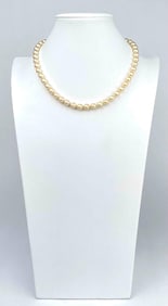 Faux pearl necklace by Kenneth Jay Lane. Necklace has a gold clasp with KJL as pictured. Faux pearls