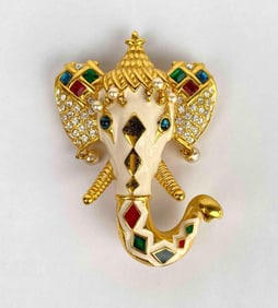 Kenneth Jay Lane elephant brooch. Elephant is beige in color with rhinestone, multi color stones,