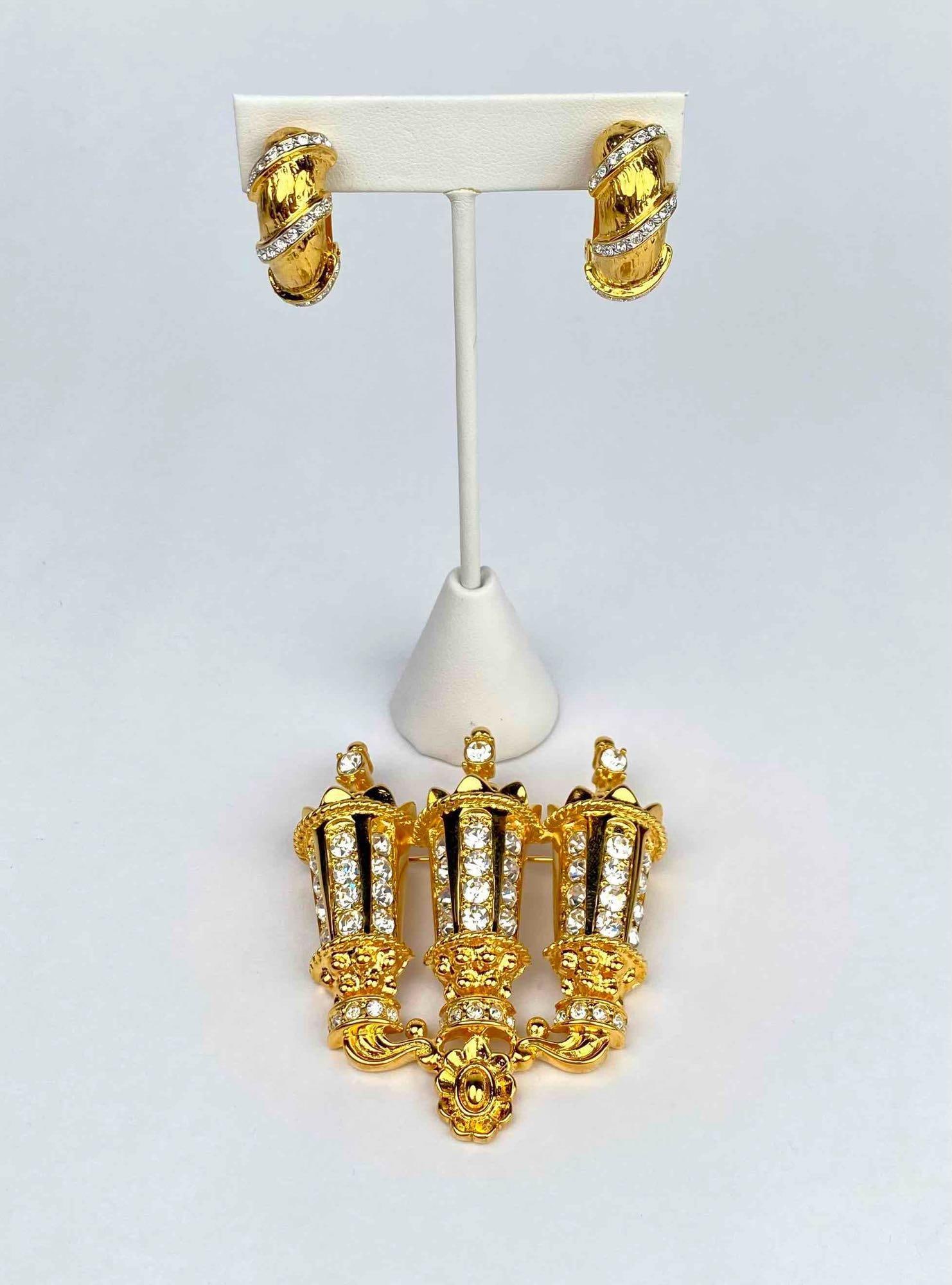Large gold tone brooch and a pair of clip on earrings by Kenneth Jay Lane. Brooch is a gold tone (1 of 12)