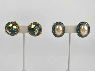 Two pairs of vintage Kenneth Jay Lane (KJL) clip on earrings. The first pair features a world globe