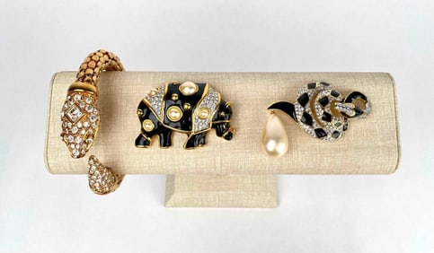 Set of 2 brooches and a cuff bracelet by Kenneth Jay Lane. Brooches are shaped as a rhino and a