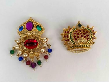 Pair of signed Kenneth Jay Lane (KJL) crown themed brooches in gold tone metal. One brooch features