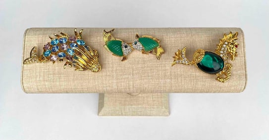 Lot of 3 gold tone sea animal themed brooches by Kenneth Jay Lane. Animals include a seahorse, 2