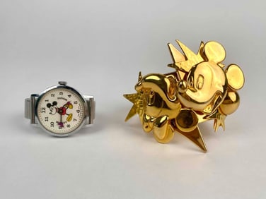 Lot of two Disney themed accessories including a vintage Mickey Mouse wristwatch and a bold cuff