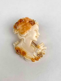Carved Italian shell cameo brooch pendant featuring a high relief profile of a woman with elaborate