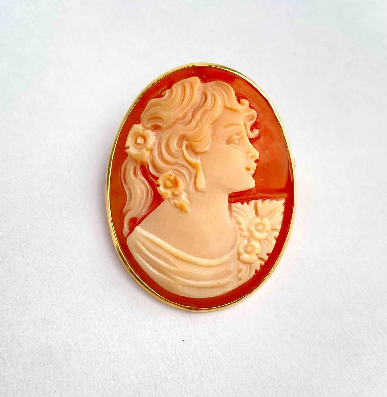 Carved Italian shell cameo pendant brooch, depicting a woman in profile with floral accents in her (1 of 8)