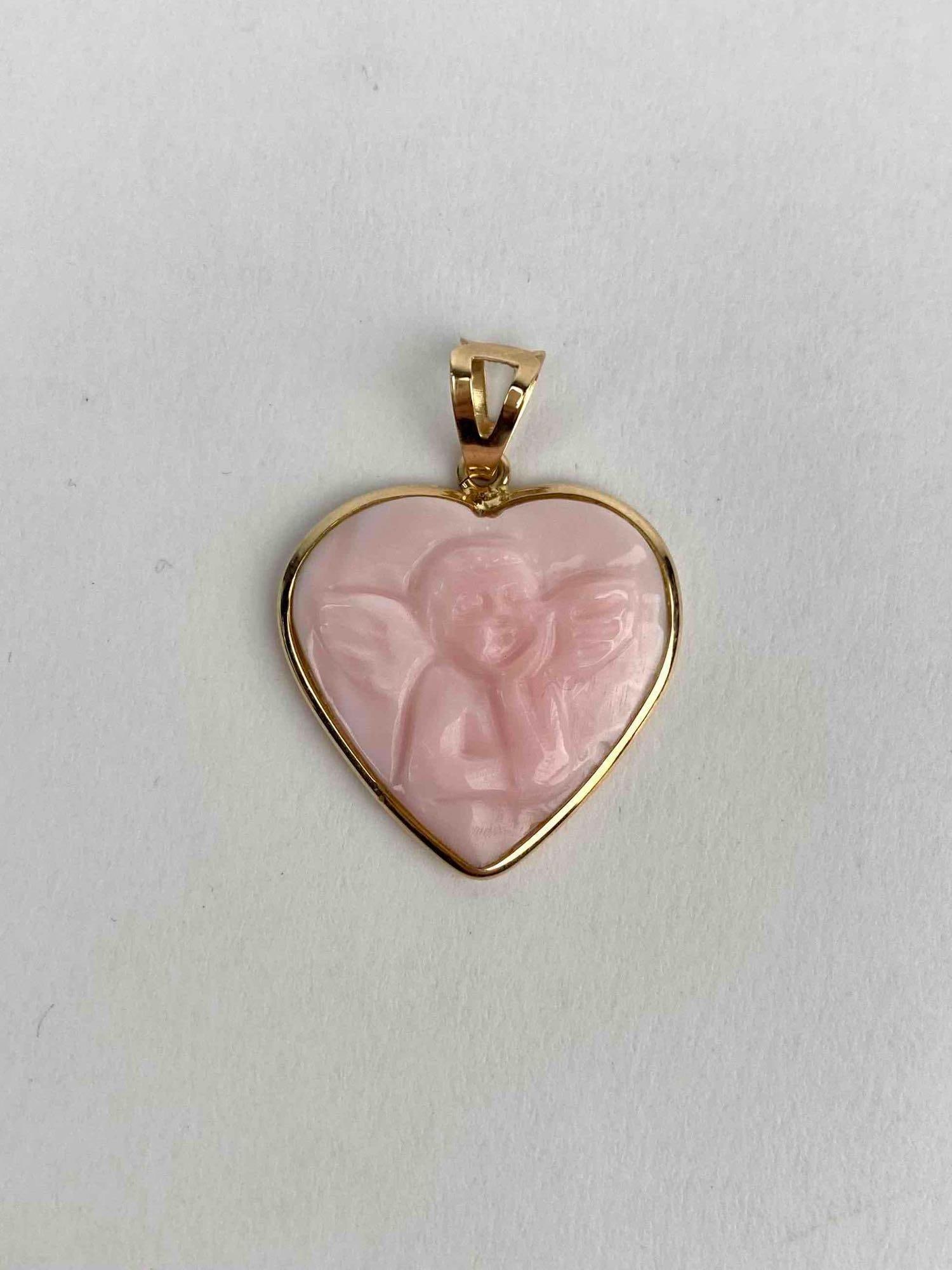 14K gold Italian heart shaped pendant showcasing a hand carved pink shell cameo of a cherub in (1 of 8)