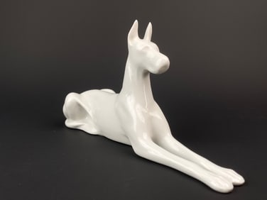 Porcelain Figurine of a Reclining Dog