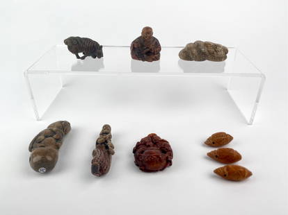 Collection of Nine Miniature Carved Netsuke and Beads: Diverse group of nine miniature carved objects in the style of Japanese netsuke and Chinese toggle beads, in various materials including wood, resin and stone. Group includes three carved figural nets