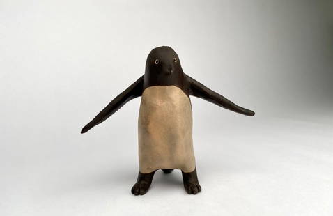 Signed Studio Redware Pottery Penguin Paperweight: Handcrafted redware pottery penguin figurine featuring a brown and beige color palette. Detailed with expressive features, this piece showcases a signed mark on the underside. Item is in good conditio