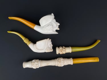 Group of Four Hand Carved Meerschaum Smoking Pipes with Figural and Floral Motifs