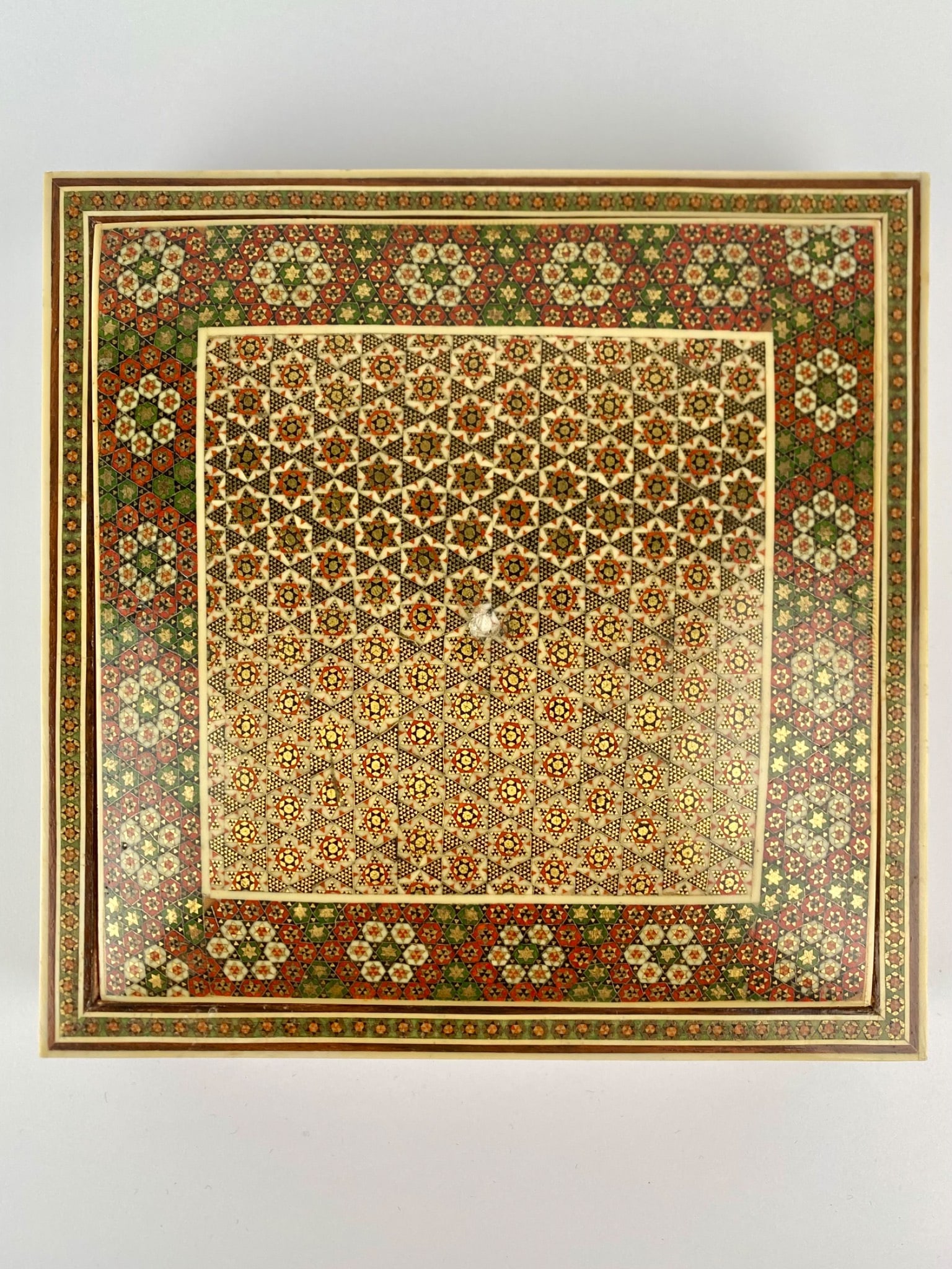 Persian Khatam Inlay Jewelry Box with Red Velvet Interior: Square Persian marquetry jewelry or keepsake box featuring a detailed geometric mosaic inlay work in traditional star and floral patterns. The exterior is decorated with finely inlaid pieces of wood,