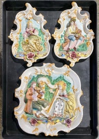 Set of Capodimonte Three Hand-Painted Porcelain Wall Plaques Decorated with Romantic Scenes (1981)