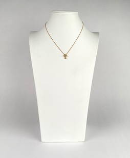 Tiffany & Co. Elsa Peretti 18k Gold and Diamond Cross Necklace: Tiffany & Co. Else Peretti 18k yellow gold and diamond cross pendant necklace featuring a delicate chain and a cross shaped charm. The piece is hallmarked Tiffany & Co. on the clasp and cross