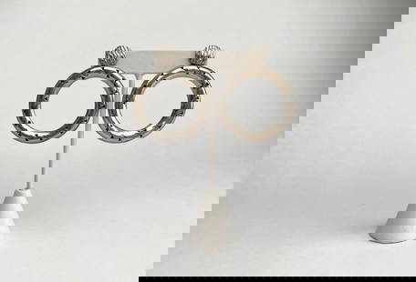 Sterling Silver Hoop Earrings with Engraved Details: Sterling silver hoop earrings featuring engraved details on the front face and textured stud tops. The reverse side of each earring displays smooth finishes, along with visible hallmarks. Push back