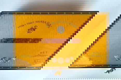 Elie Bleu Flor Fina Humidor for Fine Havana Cigars: Elie Bleu humidor, signed and marked Flor Fina, designed for storing fine Havana cigars. Exterior features striking polished wood with decorative inlay, gold detailing, and a lockable front with an or