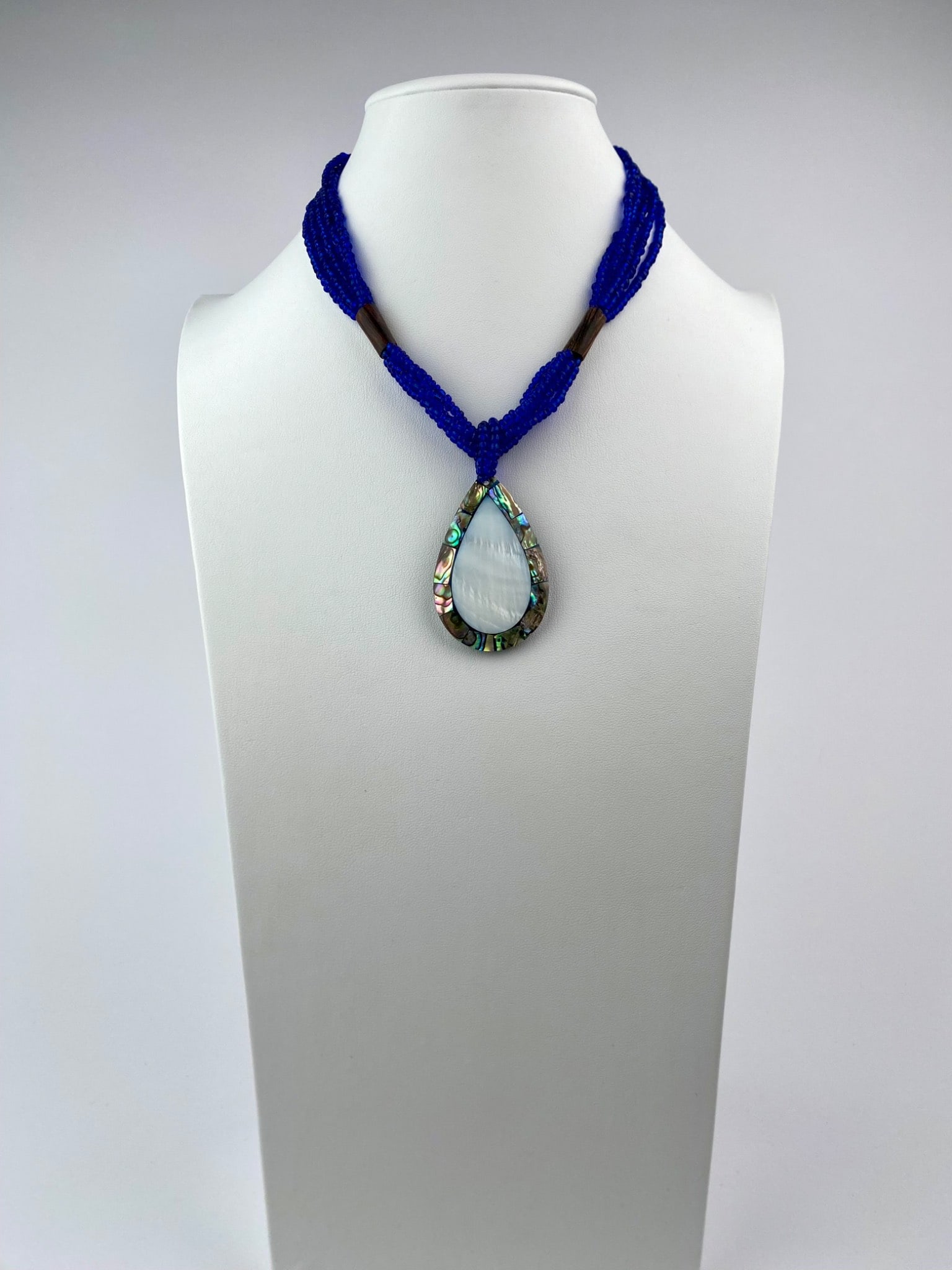 Multi Strand Cobalt Beaded Necklace with Abalone and Mother of Pearl Teardrop Pendant (1 of 9)