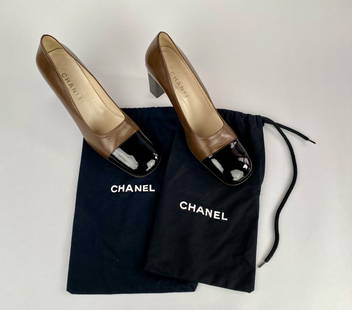 Chanel Brown and Black Heels with Dust Bags (Size 40.5): Chanel brown leather heels with black patent leather cap toes featuring a block heel design. These shoes are stamped Made in Italy and are marked as size 40.5. The heel includes the Chanel logo on a m