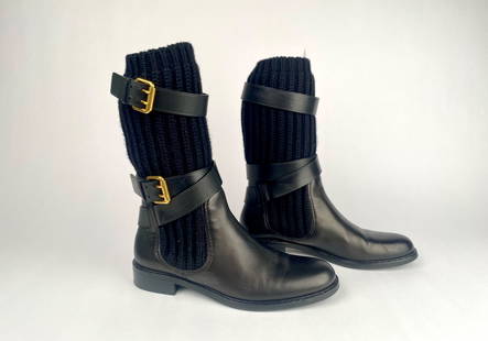 Gucci Black Leather and Wool Lockhart Boots (Size 37.5): Gucci black leather and knit mid calf boots featuring gold tone buckle accents and a ribbed knit upper. Branding includes Gucci embossed on the leather heel and the inscribed logo on the gold buckle.