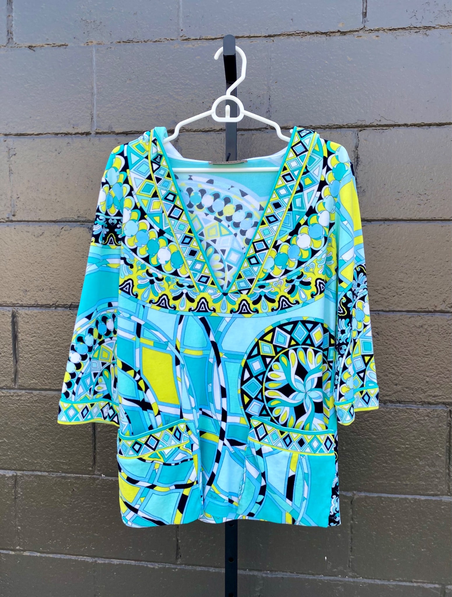 Emilio Pucci Hooded Cotton Blend Tunic (Size 4): Emilio Pucci hooded tunic, made in Italy, composed of 75% cotton and 25% nylon/polyamide. This colorful garment features a geometric print in vibrant blue, yellow, white, and black tones, with a V nec