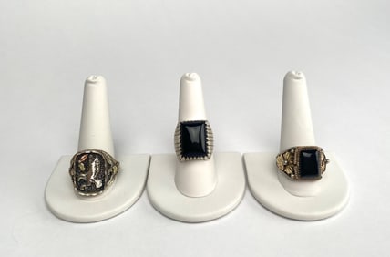 Three Sterling Silver and Black Onyx Rings with Gold Details