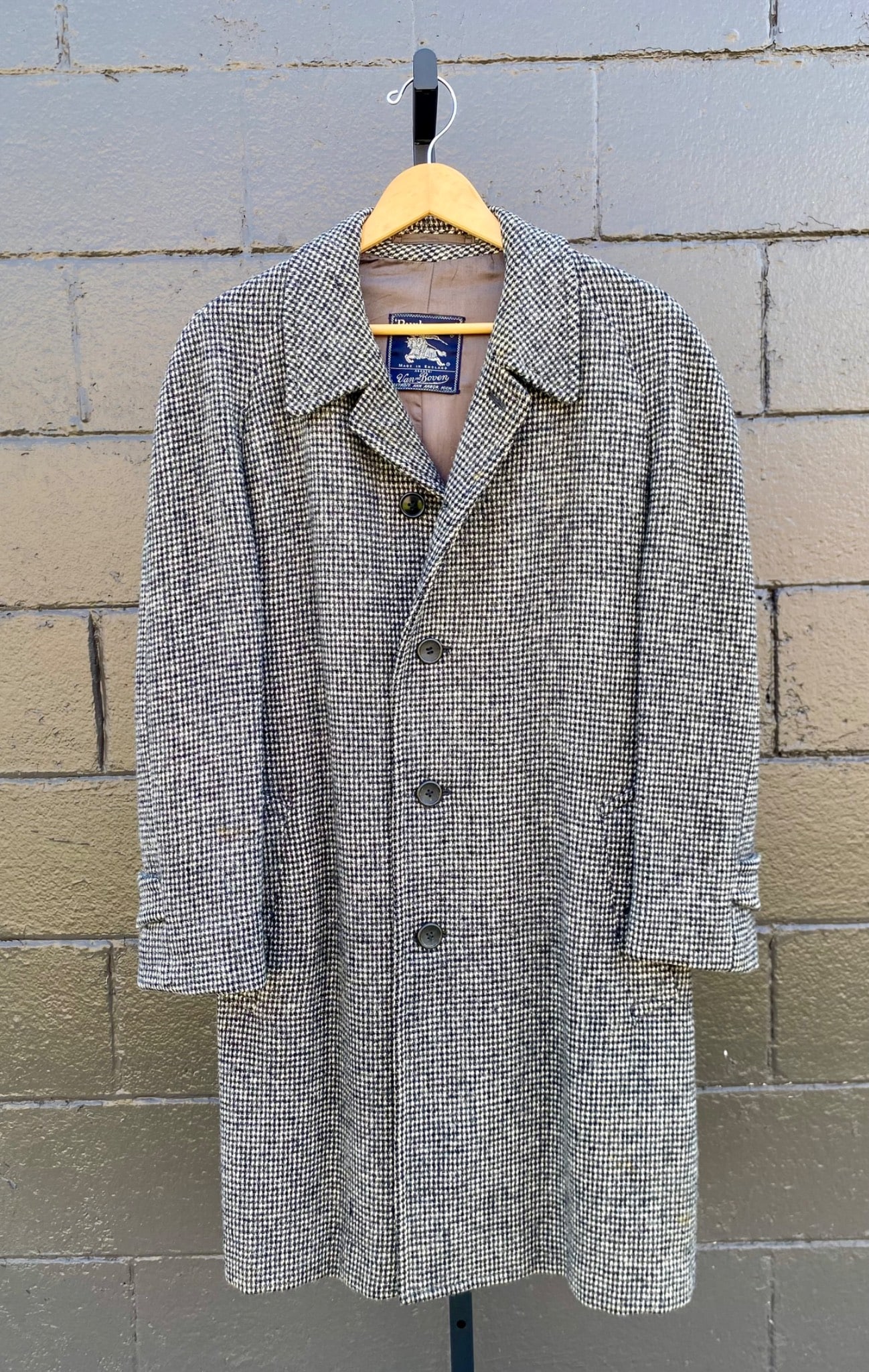 Vintage Burberrys Harris Tweed Houndstooth Overcoat: Burberrys Harris Tweed coat featuring a classic black and white houndstooth pattern. Made in England, this long overcoat includes a back vent, button closures, and button detailing on the sleeve cuffs