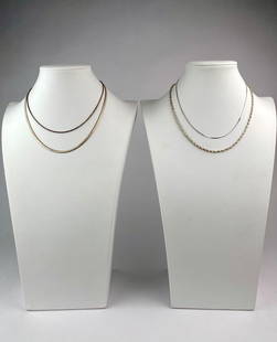 Set of Four Vintage Sterling Silver Necklaces in Assorted Chain Styles: Set of four vintage sterling silver necklaces, each featuring a unique chain design. Included are a box chain, a herringbone chain, and two rope twist chains. Two of the necklaces are marked &quot;STE