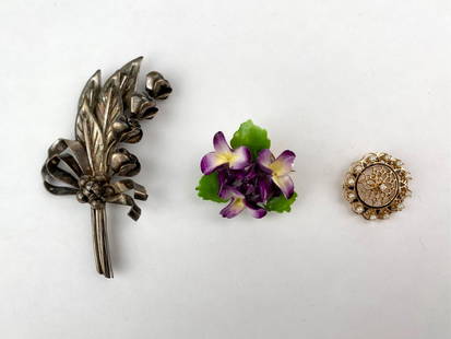 Set of Three Vintage Brooches- Sterling, Porcelain, 14K Gold: Group of three vintage brooches, included is a large sterling silver floral spray brooch designed as a bouquet with curled ribbon detailed. Also included is a hand-painted porcelain violet brooch mark