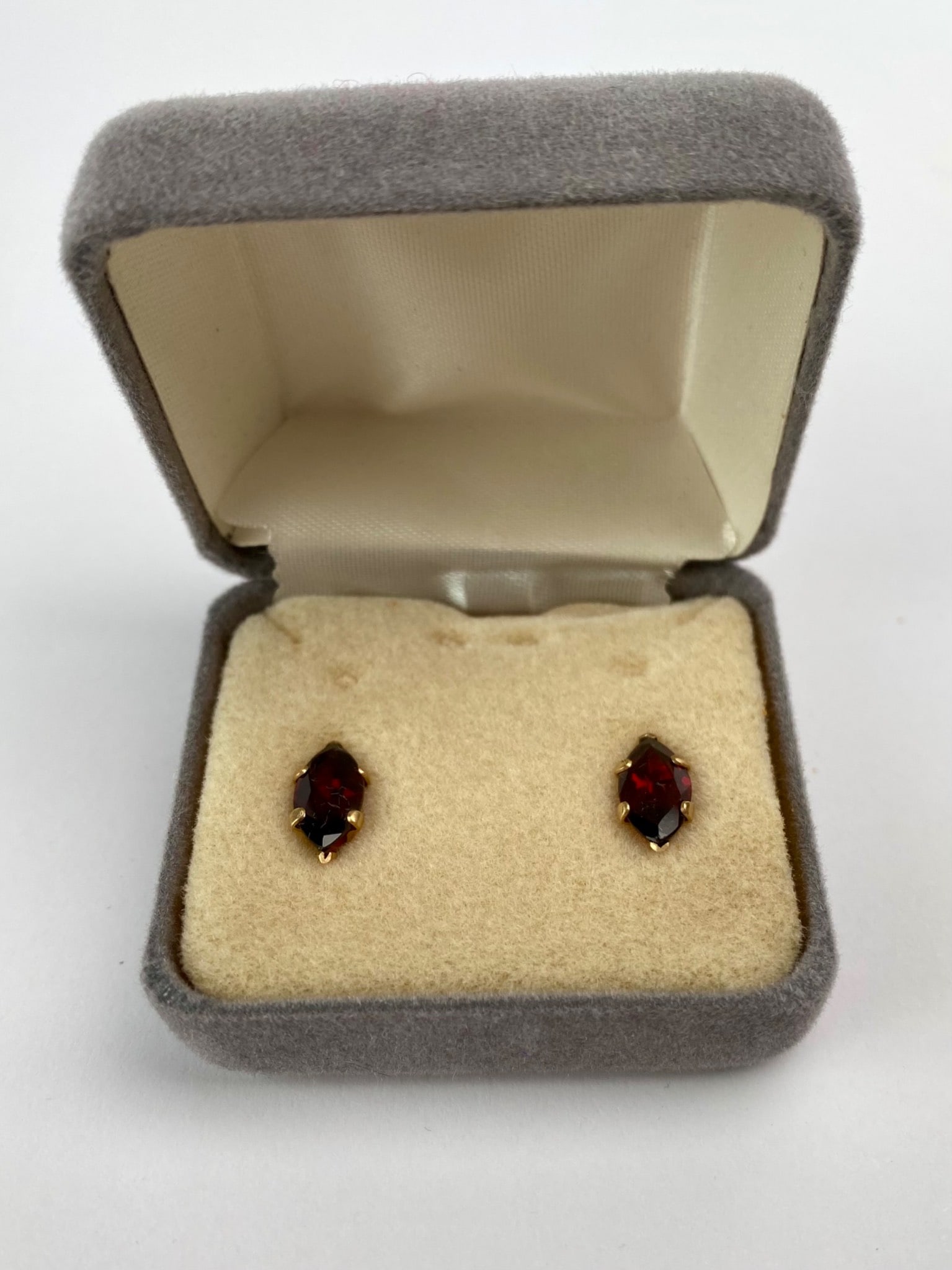14K Gold Marquise-Cut Garnet Stud Earrings, 3.50CT TW: Pair of marquise-cut garnet stud earrings set in 14K yellow gold. Each earring features a deep red garnet in a six-prong setting with an estimated total carat weight of 3.50 carats. The backs are stan