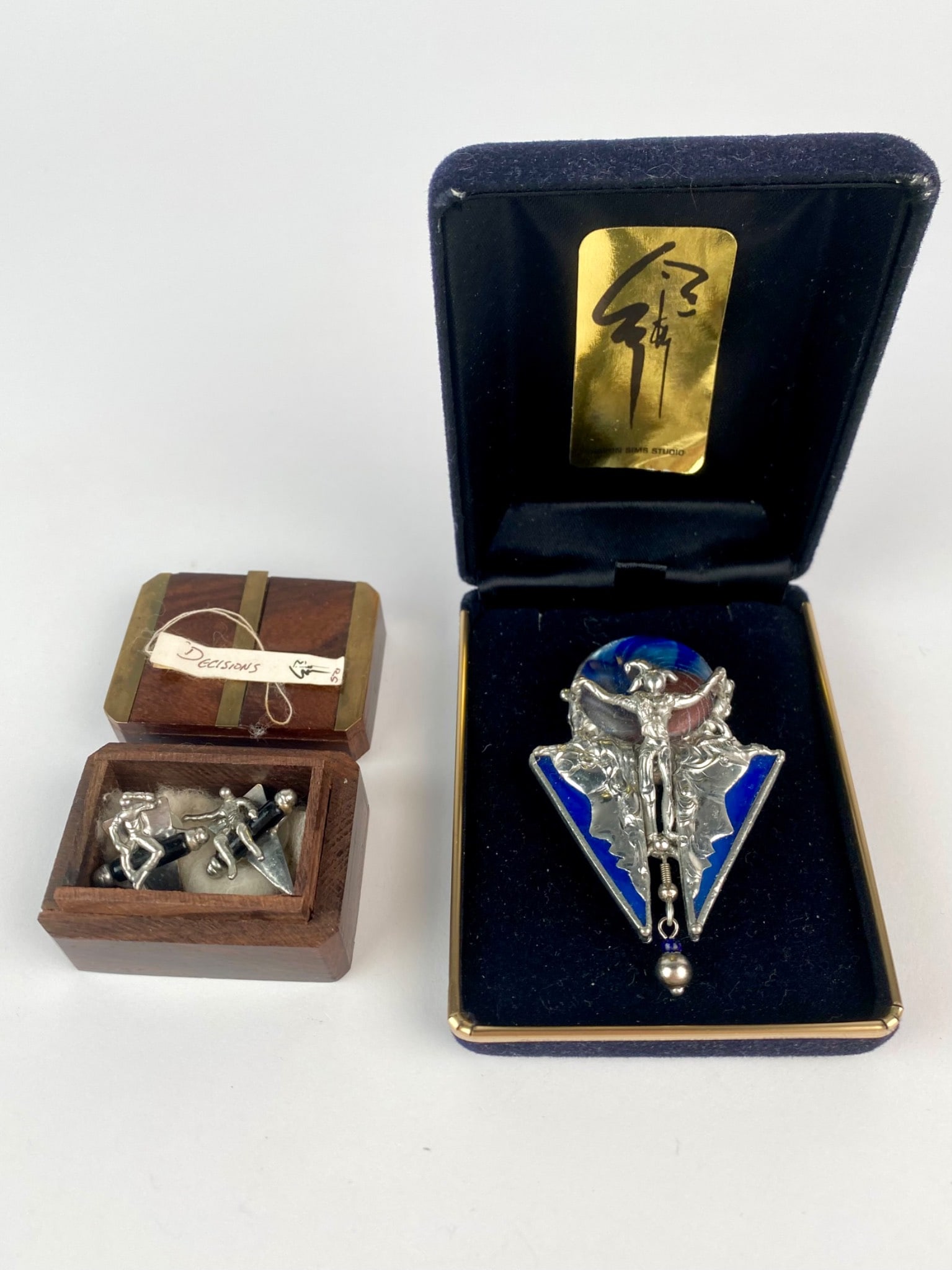Sharon Sims Studio The Clown Brooch and Decisions Earring Set: Mixed metal jewelry set by Sharon Sims Studio, featuring one large brooch titled "The Clown" (1990) and a pair of earrings titled "Decisions" (1993). The brooch is cast in silver-t