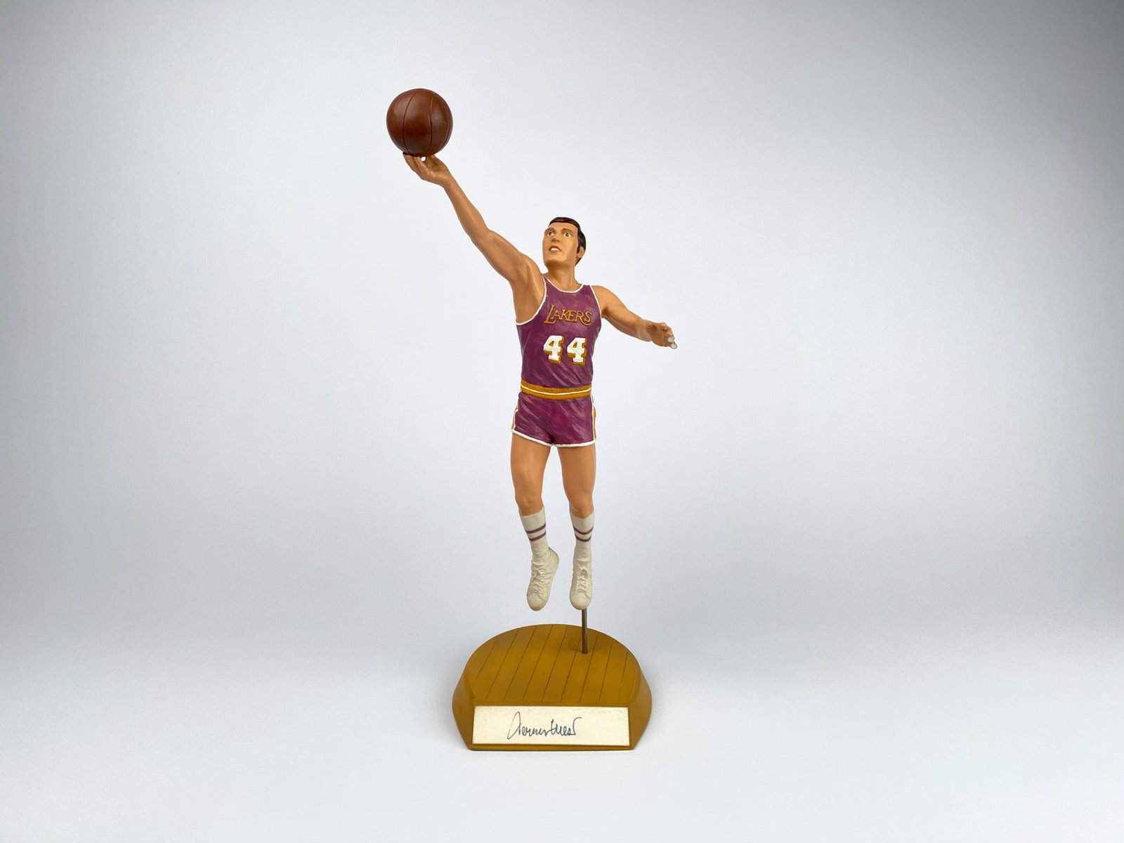 Autographed Jerry West Mr. Clutch Limited Edition Figurine: Jerry West ‘Mr. Clutch’ limited edition figurine, manufactured by Salvino Inc. in 1991. Handcrafted in Spain and numbered out of 300. The figure showcases Jerry West in action wearing his iconic L