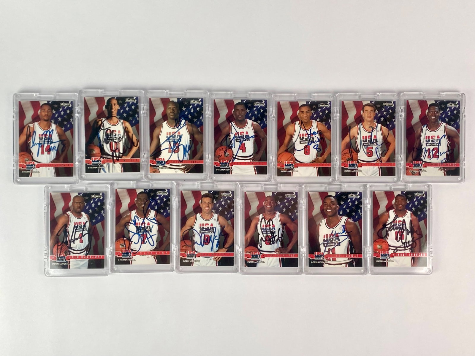1994 USA Basketball SkyBox Autographed Factory Sealed Card Set: Complete set of thirteen factory sealed 1994 SkyBox USA Basketball "International" trading cards, each featuring a color portrait of a team member in front of an American flag backdrop. Every card is 