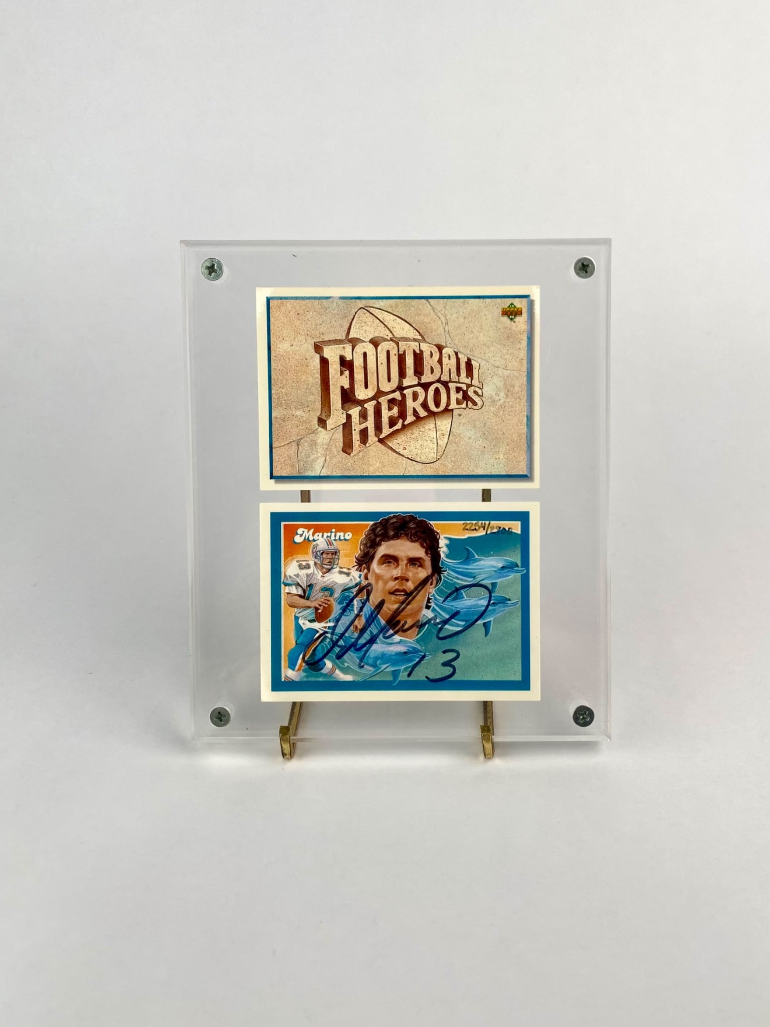 Dan Marino Signed 1992 Upper Deck Factory Sealed Football Heroes Cards: Signed and factory sealed 1992 Upper Deck "Football Heroes" trading card featuring Hall of Fame quarterback Dan Marino of the Miami Dolphins. The card showcases original artwork by Jim Auckland and is